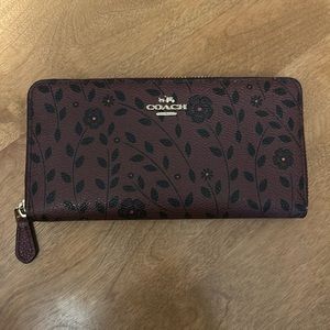 Coach burgundy/purple floral wallet. Some wear see pictures.